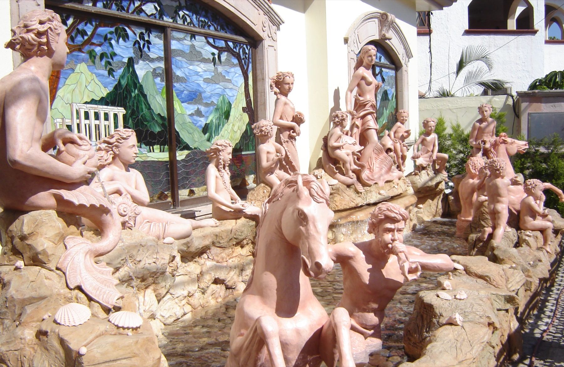 Sculpted group of figures in a hand-finished garden grotto by Decorative and Faux Finishes
